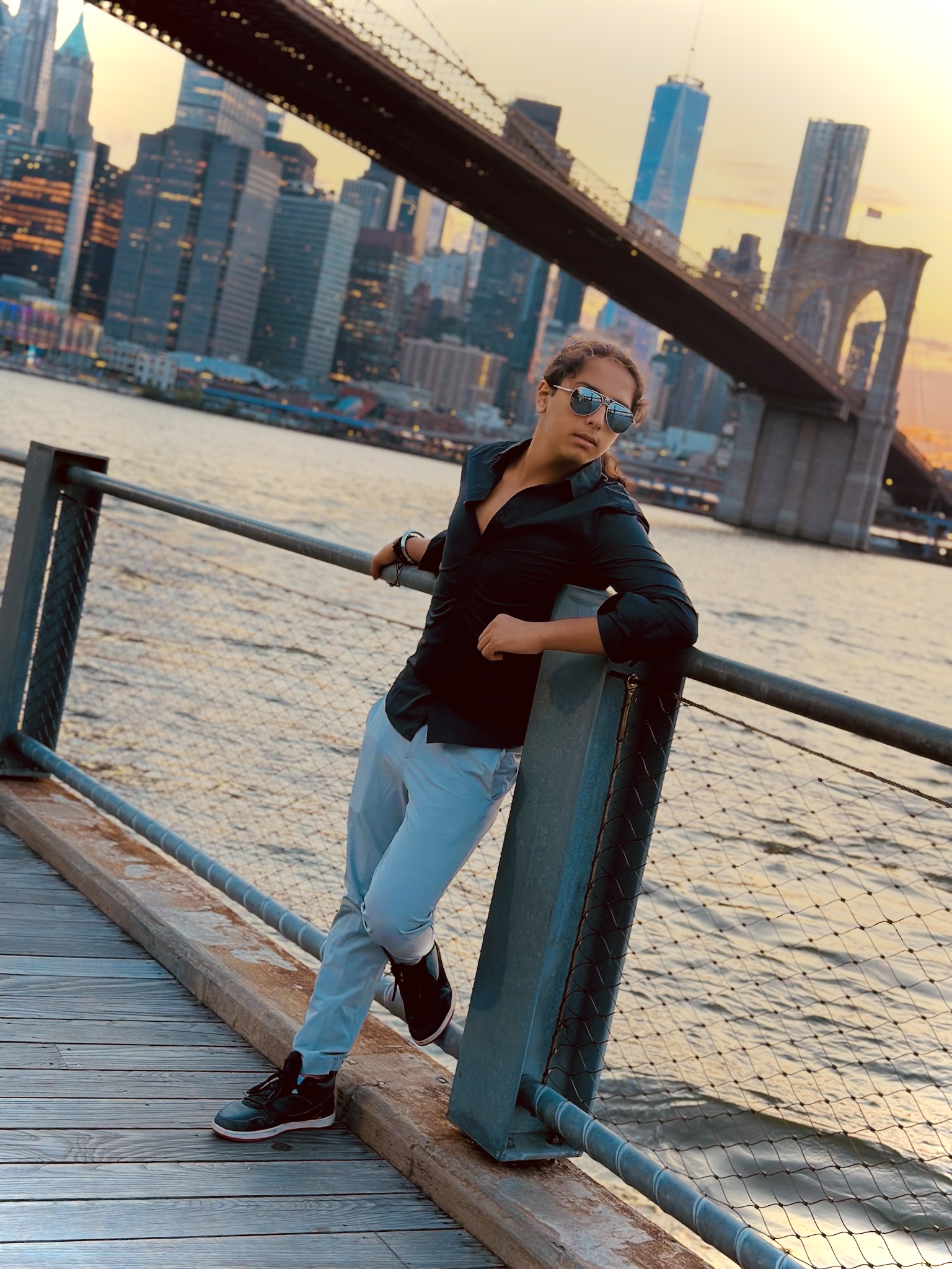 Aryan Rohira silhouetted against a vibrant Miami sunset